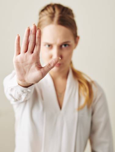 woman-demonstrating-stop-gesture-79DUL9J (1) (1)