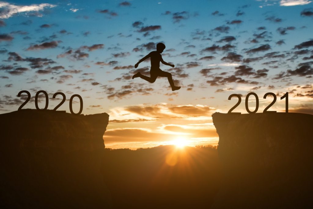 happy-new-year-2021-concept-silhouette-of-man-jump-57ZMKZ5 (2)